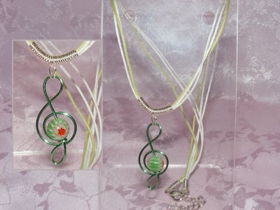 Green lampwork glass music themed necklace