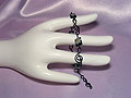 Black treble clef lampwork glass bracelet