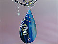 Blue pear drop Agate music themed necklace
