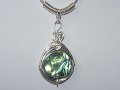 Round abalone shell music themed necklace