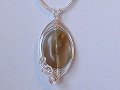 Brown oval Tourmaline music themed necklace