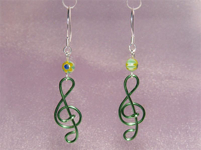 Green lampwork glass music themed earrings