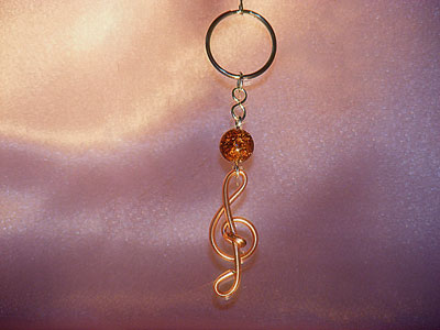 Music themed light brown treble clef key ring