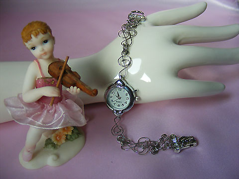 Music themed silver tone bracelet watch