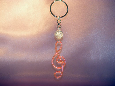 Neon pink treble clef music themed key ring