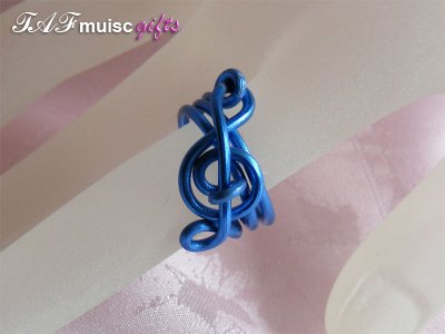 Blue treble clef music themed statement ring