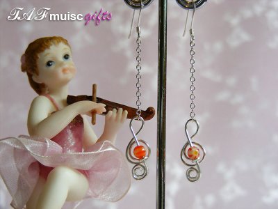 Orange glass bead treble clef music themed earrings