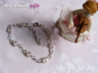 Pink rose quartz treble clef music themed bracelet