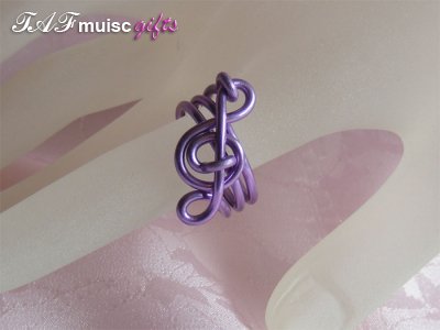 Purple treble clef music themed statement ring