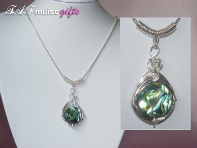 Round abalone shell music themed necklace