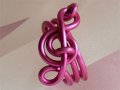 Pink treble clef music themed statement ring